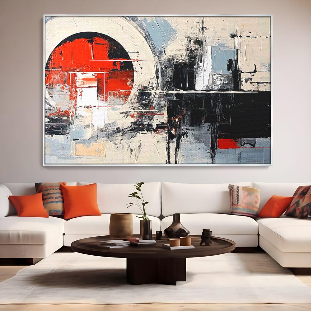Tablou canvas cu tablou canvas cu cerc rosu si geometrie abstracta, in rama de aluminiu argintiu, pe perete intr-un living